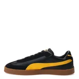 Championes Puma Club II Era, color negro con detalles en amarillo y suela marrón.