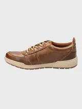 Championes urbanos Hush Puppies modelo Draper, color azul marino, confeccionados en cuero, con cordones grises, plantilla Smart Foam® y suela de goma color beige.