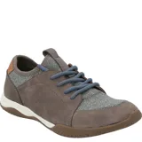 Championes Hush Puppies modelo Space, color celeste con detalles en marrón y suela marrón. Capellada de cuero con cuello de lycra y planta con tecnología GreenFoam® en base a caña de azúcar.