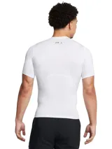 Remera deportiva blanca Under Armour HeatGear Armour de manga corta, corte ajustado y logo negro en el pecho.