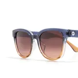 Lentes de sol Sunski modelo Miho Dawn Terra Fade, con montura degradada de azul a naranja y lentes marrones polarizadas.