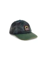 Gorra Deus Ex Machina modelo Vacay Check, con visera curva, confeccionada en tejido a cuadros en tonos verde, azul y negro. Presenta logo de la marca bordado en el frente.