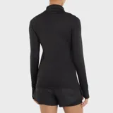 Buzo deportivo negro de manga larga con medio cierre frontal y efecto melange.