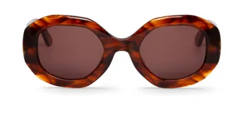 Lentes de sol con marco de acetato en tono carey y cristales ahumados.