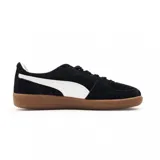 Championes Puma Palermo negros con detalles en blanco y suela color caramelo.