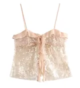 Top de fiesta con lentejuelas y breteles finos, con volados en el escote y lazo ajustable en el centro.