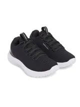 Championes de entrenamiento Under Armour UA W Dynamic 2 para mujer, color negro con suela blanca y logo de la marca en el talón.