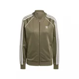Campera Adidas Classics SST color verde oliva con cierre frontal, cuello redondo y tres rayas blancas en las mangas. Logo de Adidas bordado en el pecho.