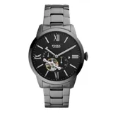 Reloj Fossil automático para hombre, con caja y correa de acero inoxidable color grafito, esfera negra con números romanos y agujas plateadas. Mecanismo a la vista en la parte inferior de la esfera.