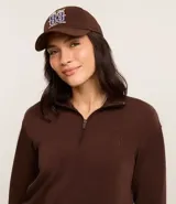 Buzo deportivo confeccionado en modal color marrón, con cuello alto y manga larga. Presenta cierre frontal con cremallera y estampa localizada bordada.