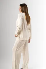 Pantalón palazzo color crema de morley de vara ancha en algodón y viscosa, con bolsillos y cintura elastizada.