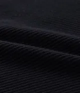 Musculosa blanca de rib con textura acanalada, escote cuadrado y breteles medianos. Confeccionada en algodón certificado BCI y elastano.