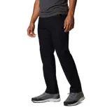 Pantalón de hombre color azul marino, de corte recto, con bolsillos laterales, bolsillos de seguridad con cierre y bolsillo para cuchillo. Confeccionado en tejido elástico con tecnología Omni-Shade UPF 50.