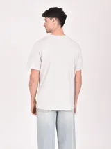 Remera gris claro con estampa de auto clásico americano y texto "American Classic - King of the Road".