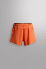 Shorts deportivos color naranja de tejido técnico ligero y elástico, con forro interior, cintura elástica ajustable con cordón, bolsillo trasero con cierre y logo estampado en la pierna. Zara Athleticz.