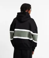 Buzo masculino con capucha, confeccionado en algodón y poliéster. Presenta diseño a rayas y bloques de color, con mangas largas ajustadas.