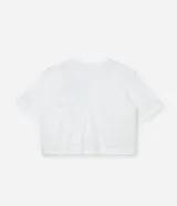 Remera blanca de algodón con cuello redondo, mangas cortas y aplicación de cinta contrastante formando un lazo negro en el frente.