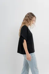 Buzo verde agua de algodón grueso, manga corta y corte oversize.