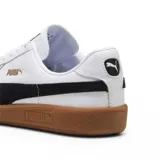 Championes Puma Army Trainer, color negro con detalles en blanco y suela color caramelo.