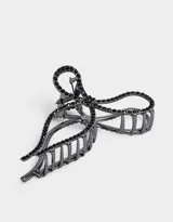Broche para el pelo negro con forma de moño y apliques de strass.