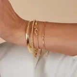 Esclava rígida dorada de oro 18k.