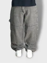 Pantalón baggy carpenter negro gastado de tela denim.