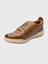 Championes urbanos Hush Puppies modelo Draper, color azul marino, confeccionados en cuero, con cordones grises, plantilla Smart Foam® y suela de goma color beige.