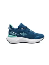 Championes deportivos Umbro modelo Rift para hombre, color azul oscuro con detalles en turquesa y suela blanca gruesa. Presenta la marca Umbro en el talón y el logo de la marca en el lateral.