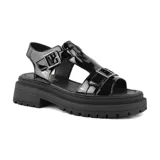 Sandalias negras de charol con hebillas plateadas y plataforma track.