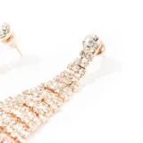 Aros colgantes dorados con forma de cascada de strass brillantes.