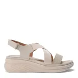 Sandalias de plataforma color tostado con tiras cruzadas elásticas y ajuste con velcro en el tobillo.