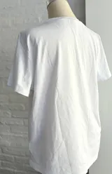 Remera blanca de manga larga con estampado de dos papayas cortadas y la palabra 'Copacabana' en azul.