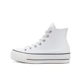 Zapatillas de plataforma alta con parte superior de lona blanca y suela de doble capa.