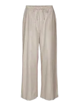 Pantalón de tiro alto color beige con rayas verticales plateadas, confeccionado en algodón orgánico con fibras metálicas y cordón en la cintura.