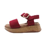 Sandalias marrones con plataforma de corcho, tira ancha sobre el empeine y pulsera al tobillo con hebilla dorada.