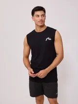 Musculosa blanca de algodón sin mangas, corte holgado y logo estampado en el pecho.