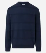 Buzo azul marino de algodón texturizado, con cuello redondo y mangas largas con puños ajustados.