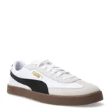 Championes Puma Club II Era de cuero blanco con detalles en negro, logo dorado y suela de goma marrón.