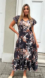 Vestido midi negro con estampado abstracto en tonos beige y blanco, mangas cortas con volados y falda con volados en el ruedo.