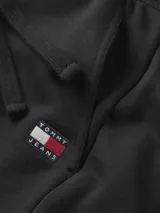 Pantalón de jogging negro de algodón, con cordones ajustables en la cintura, tres bolsillos, bajos elásticos y logo bordado de Tommy Jeans en la parte delantera.