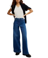 Jeans de mezclilla azul oscuro, estilo palazzo o pierna ancha, con tiro alto y bolsillos delanteros pequeños con solapa.