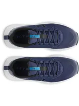 Championes de entrenamiento Under Armour Charged Commit TR 4, color azul marino con logo negro y suela blanca.
