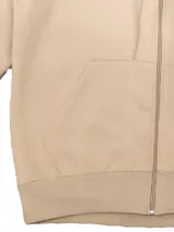 Campera deportiva unisex color verde esmeralda, confeccionada en algodón con felpa, con capucha, cierre frontal y bolsillos tipo canguro.