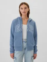 Canguro azul con logo de Gap en la parte delantera, con forro de sherpa y capucha con cordones.