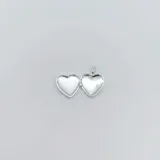 Dije relicario en forma de corazón, hecho en plata 925.