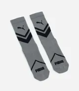 Medias deportivas Puma de caña alta, color blanco con detalles en azul y negro. Diseño con compresión y estampado geométrico.