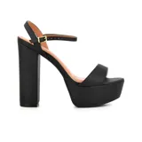 Sandalias negras de vestir marca Korium Amora, con plataforma y tacón ancho. Tira delantera ancha y tira fina con hebilla al tobillo.