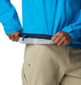 Campera impermeable Columbia Evapouration Jacket, color celeste, con capucha ajustable, cierre frontal completo, bolsillos laterales con cierre y ventilación en las axilas.