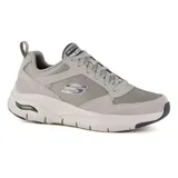 Championes grises Skechers Arch Fit Servitica para hombre. Capellada de malla, material sintético y ante. Sistema de plantilla Arch Fit con soporte en el arco plantar certificado por podólogos. Entresuela liviana con amortiguación y suela de goma con tracción flexible.