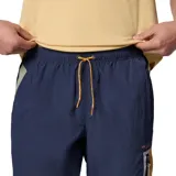 Pantalón largo de hombre Columbia, modelo Challenger Windbreak, color azul marino con detalles en naranja y bolsillo con cierre en el muslo.